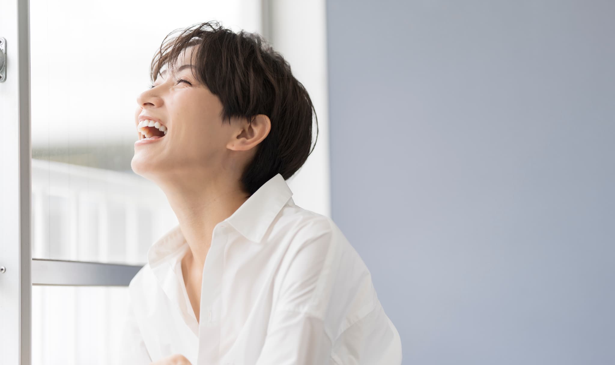 顎関節症を治療して口を開けて笑えるようになった女性
